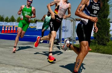 a group of men running in a race